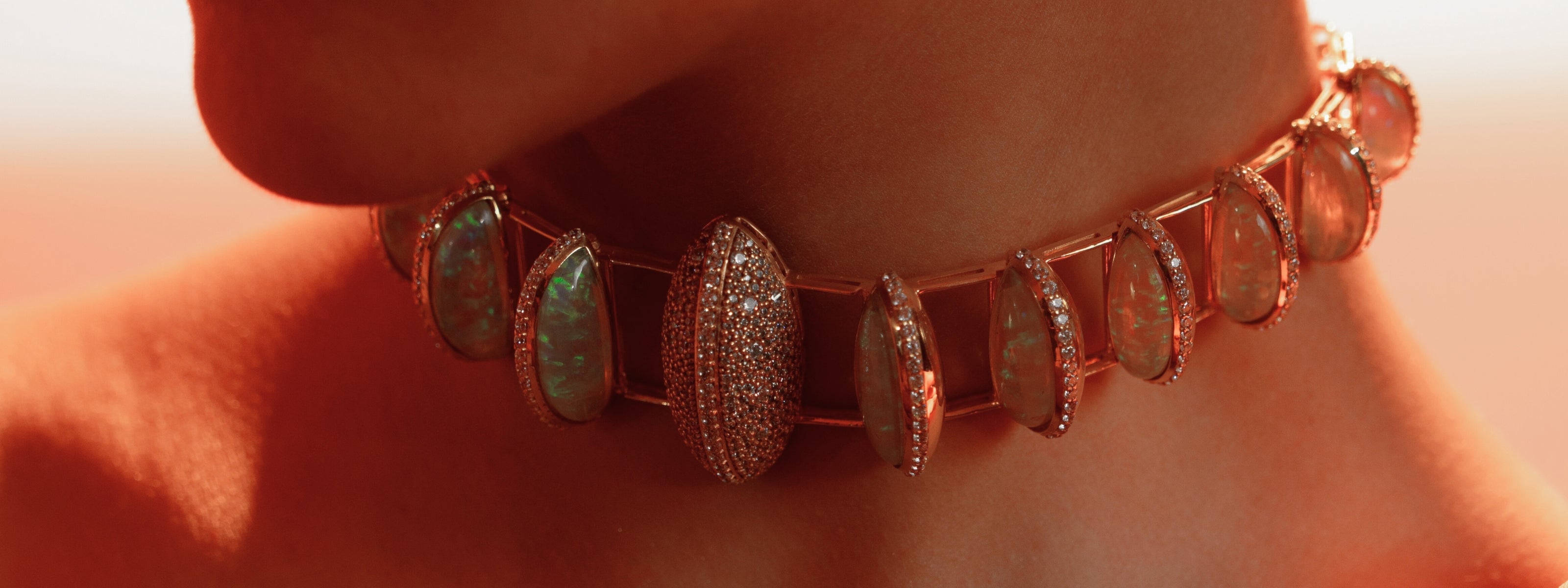 A Mhari opal and pavé choker necklace in rose-gold-plated silver, worn on the neck