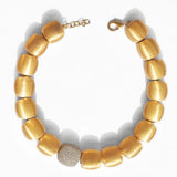 Brushed gold cube necklace with single CZ pave sphere on white background