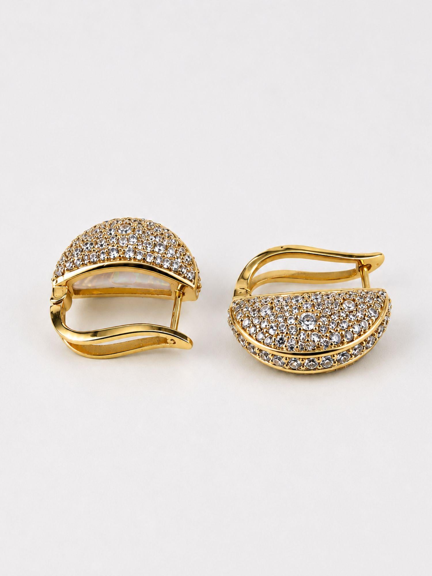 Reversible Opal Perspective earrings flipped to full zircon pavé face in 24k gold on neutral background.