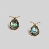 Aeris teardrop earrings with abalone labradorite stone and zircon bar detail in 24k gold on neutral background.