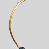 Side view of Aeris open collar bar necklace showing sculptural curve and opal teardrop pendant in gold.