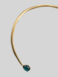 Side view of Aeris open collar bar necklace showing sculptural curve and opal teardrop pendant in gold.