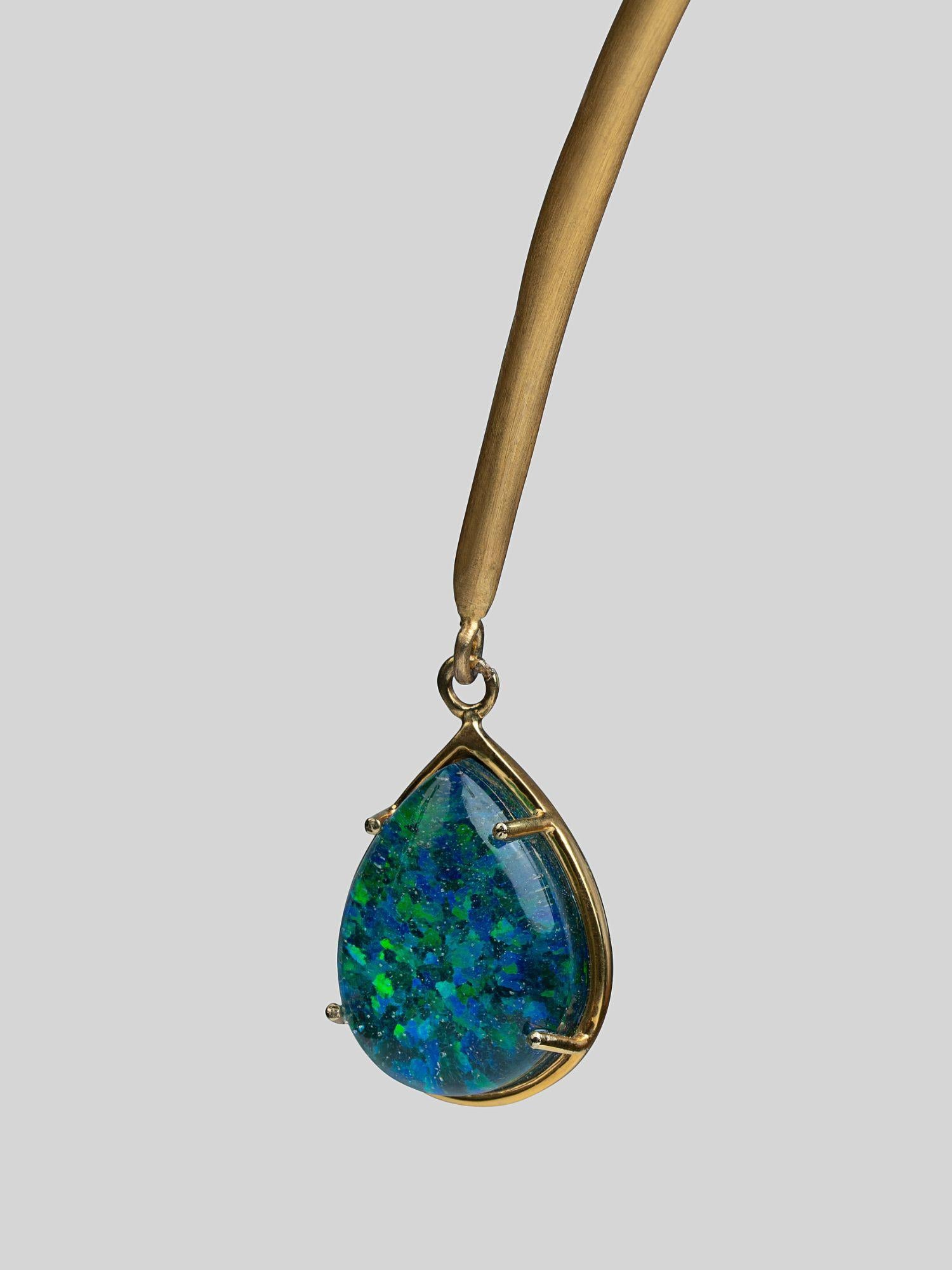 Aeris opal crystal haze teardrop pendant in gold prong setting on open bar necklace, neutral background.