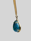 Close product shot of Aeris opal crystal haze teardrop pendant showing stone and gold prong detail.