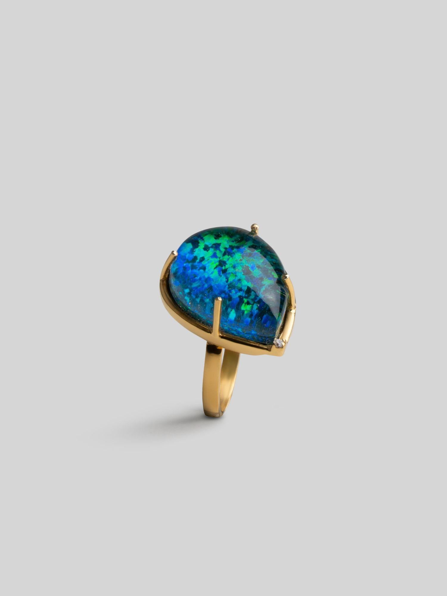 Aeris opal crystal haze teardrop cocktail ring in open 24k gold setting, front angle on neutral background.
