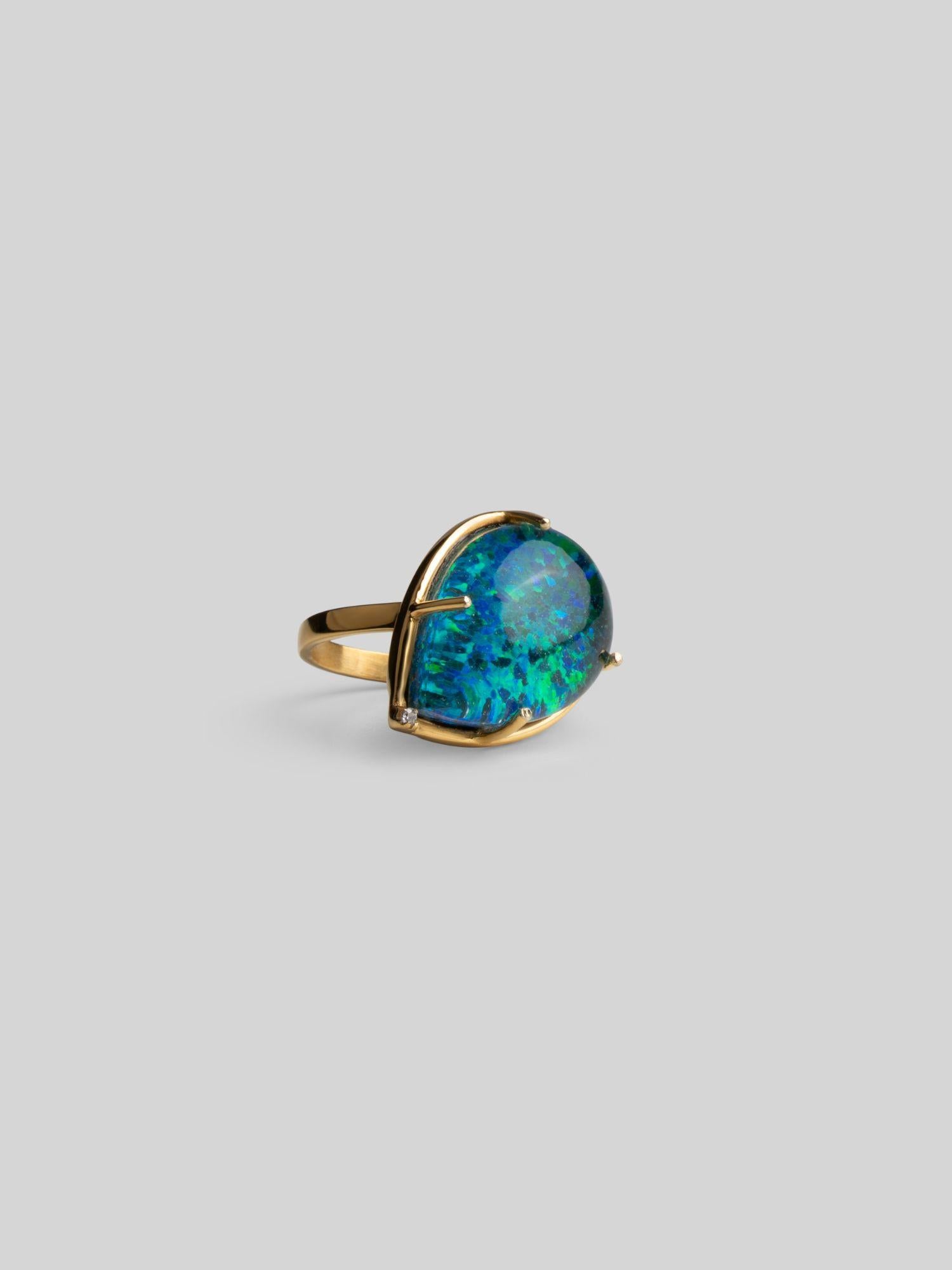 Three-quarter product shot of Aeris green opal cocktail ring in 24k gold on neutral background.
