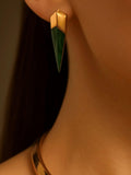 Close-up of malachite spike earring on ear with gold collar necklace visible