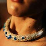 Model wearing blue opal hasli necklace close-up, warm skin tones