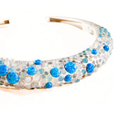 Angled product shot of silver hasli necklace with blue fire opal and aqua chalcedony