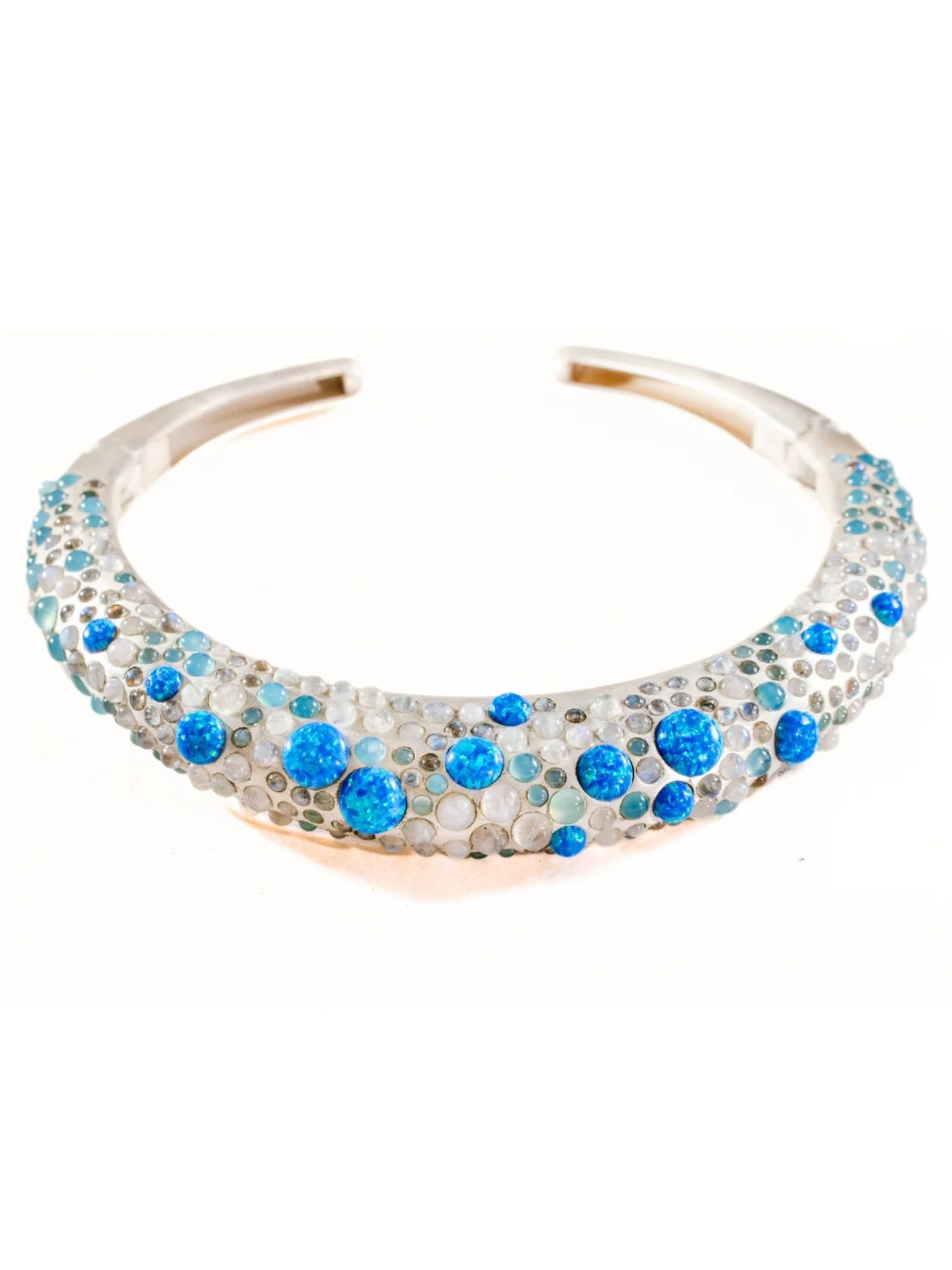 Silver hasli necklace studded with 130+ carats of blue fire opal and moonstone
