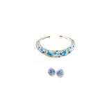 Silver hasli necklace with matching blue opal spiral earrings on white background
