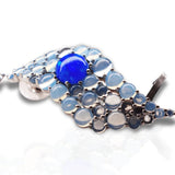 Detail shot of blue opal wave ear cuff showing stone layout and silver finish