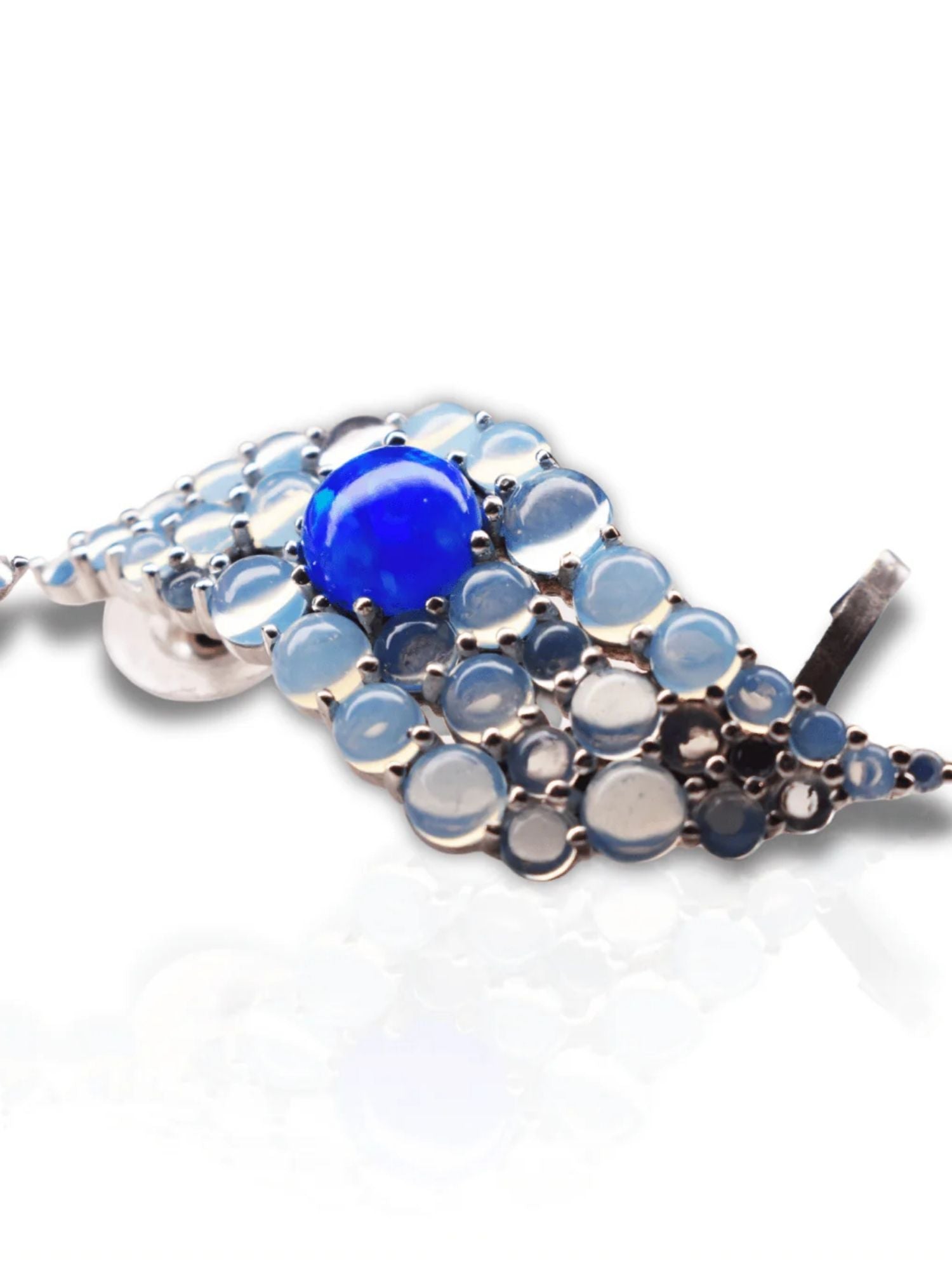 Detail shot of blue opal wave ear cuff showing stone layout and silver finish