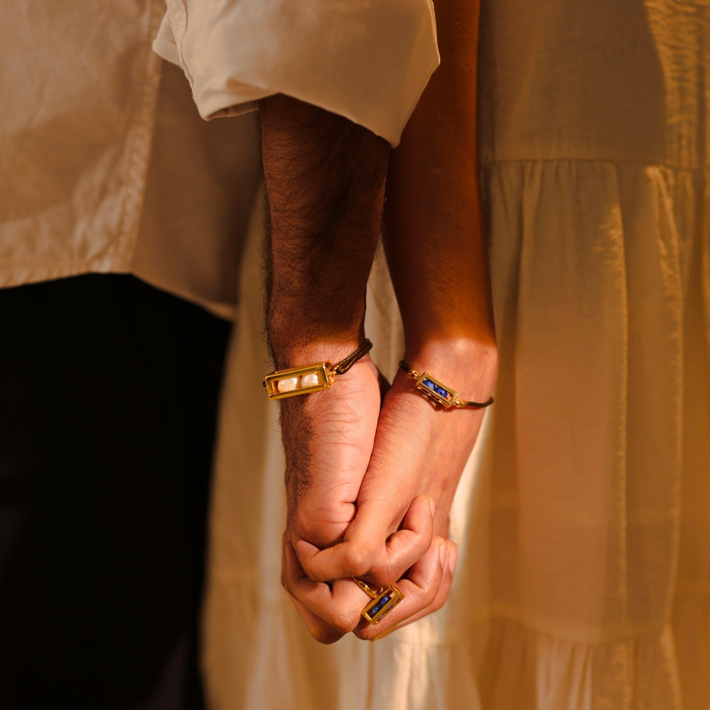 Shop Mhari Bracelets — gold-plated silver gemstone bracelets worn by a couple