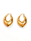 Pair of large geometric gold claw hoop earrings on white background