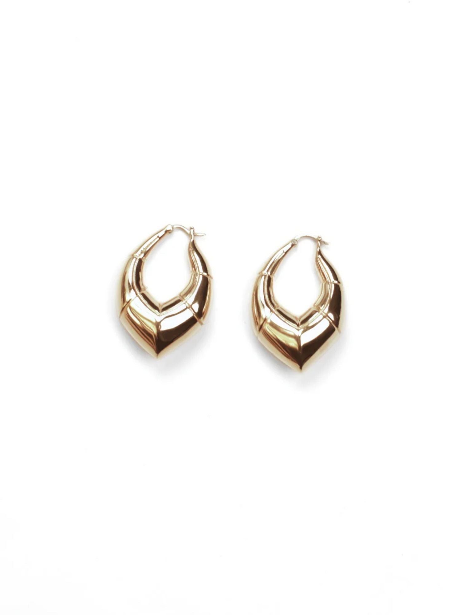 White rhodium small claw earrings side by side on white background
