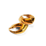 Small gold and silver claw earrings with cone stud showing size comparison