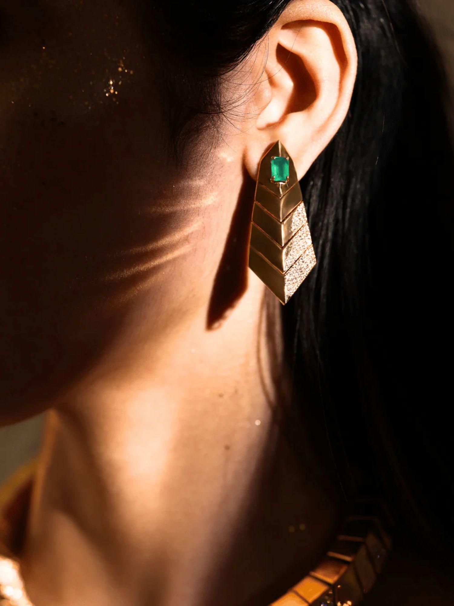 Model wearing green onyx gold earrings, side profile showing full drop length