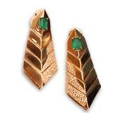 Pair of gold tie earrings with green onyx stone on white background