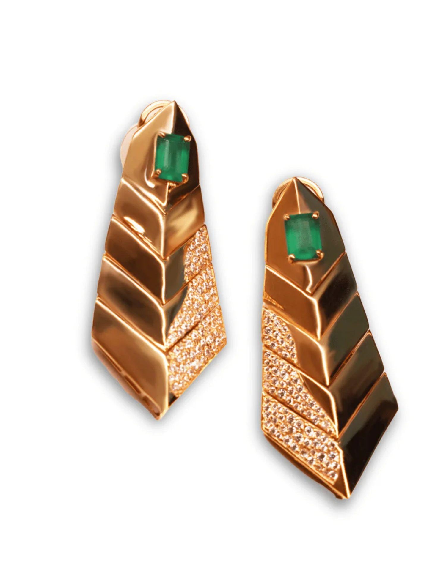 Pair of gold tie earrings with green onyx stone on white background