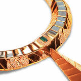 Close-up of hand-finished gold collar surface with green onyx stone and CZ detail