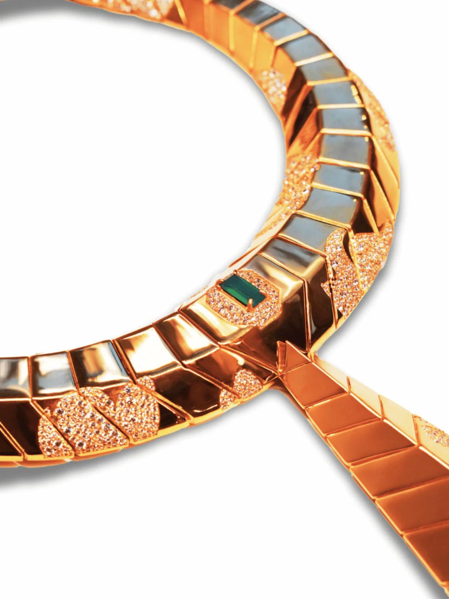 Close-up of hand-finished gold collar surface with green onyx stone and CZ detail