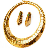 Overhead view of gold collar necklace and green onyx tie earrings set