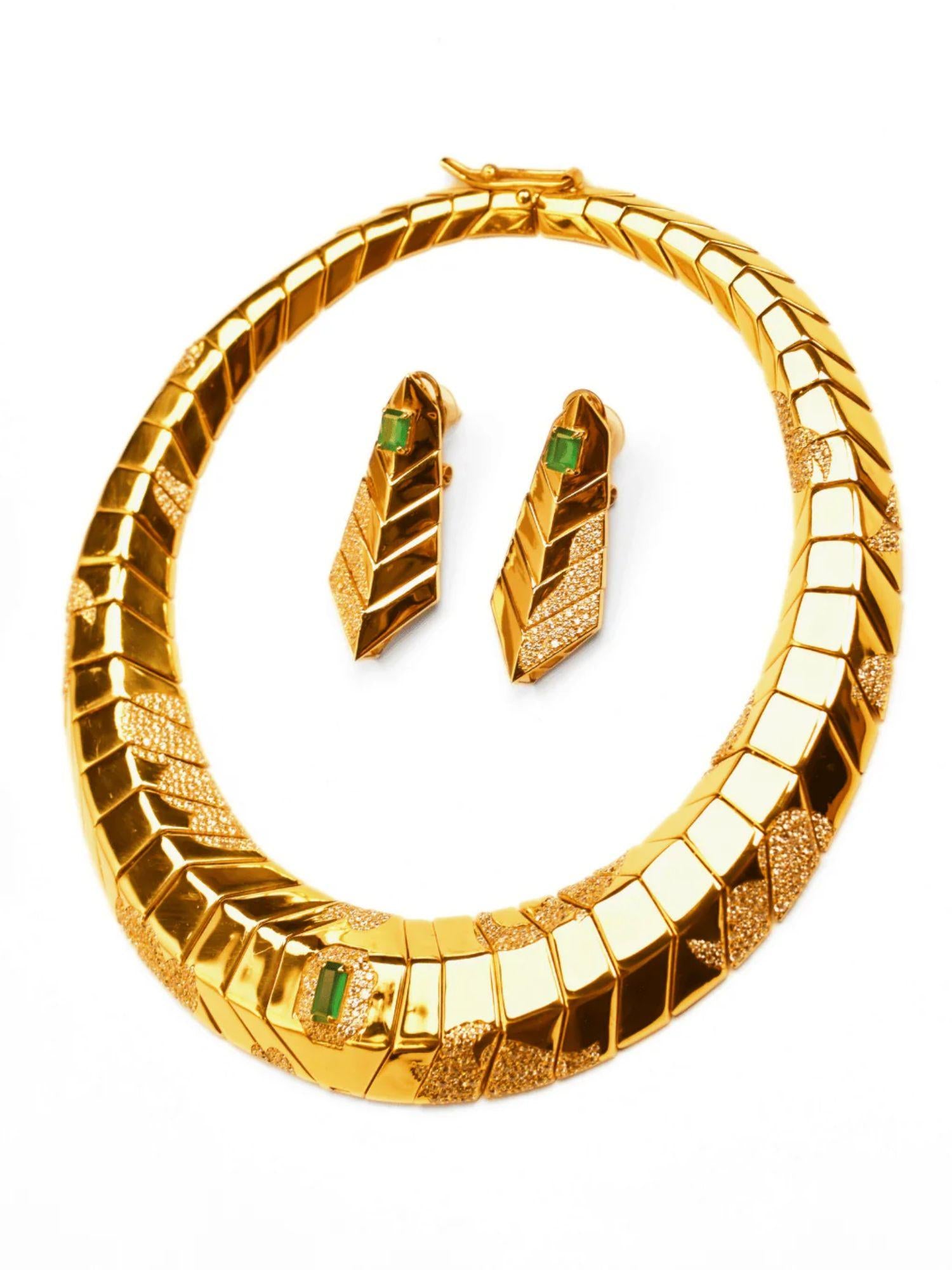 Overhead view of gold collar necklace and green onyx tie earrings set