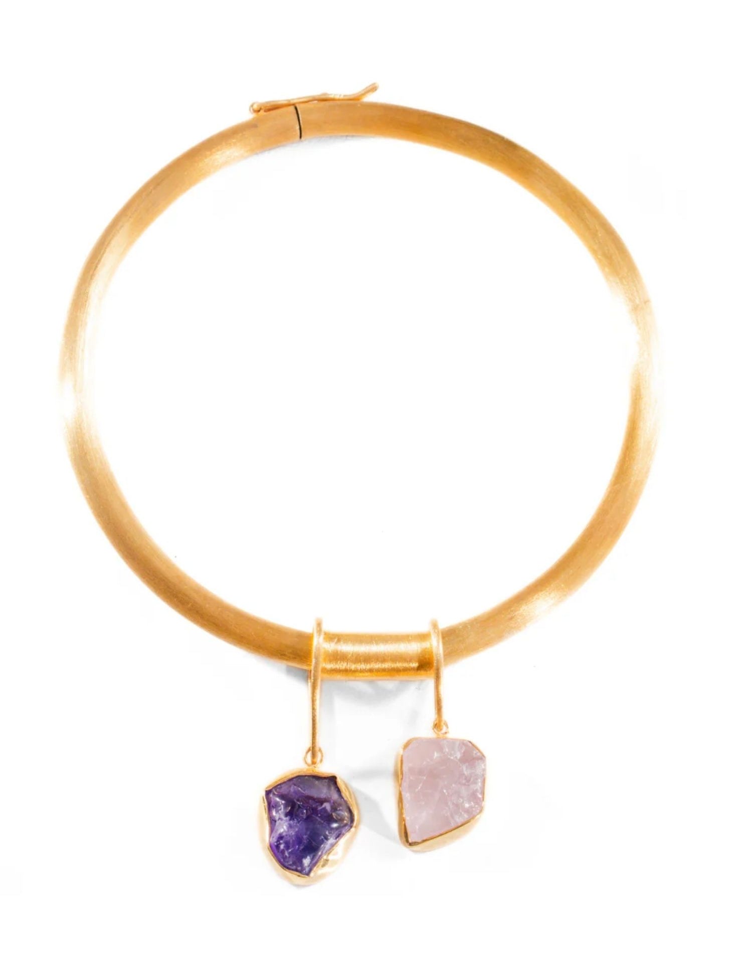 Gold choker bangle with two raw stone charm drops on white background