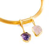Overhead detail of gold choker bangle with two raw stone drops