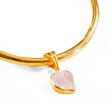 Close detail of gold choker with rose quartz raw charm