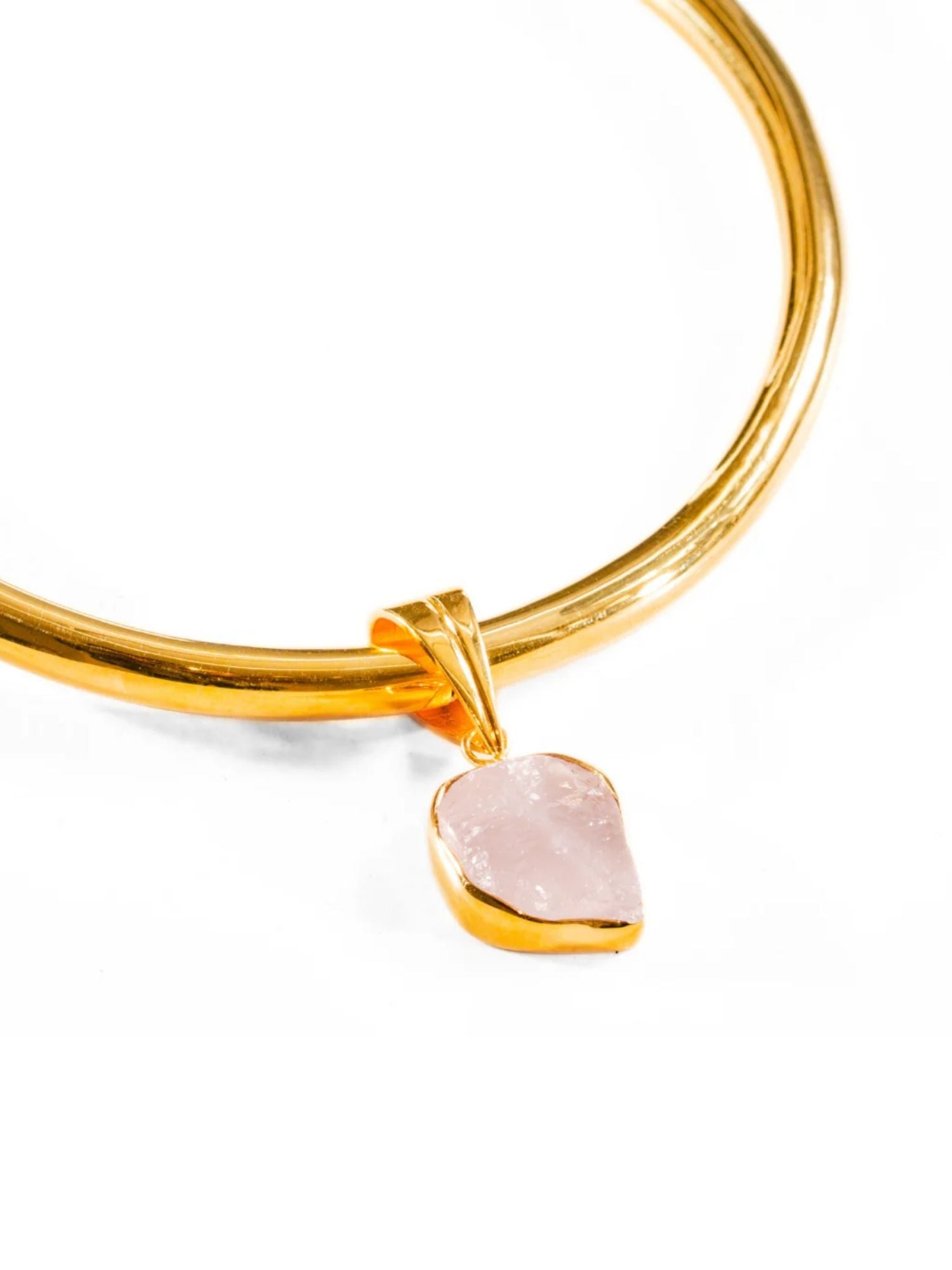 Close detail of gold choker with rose quartz raw charm