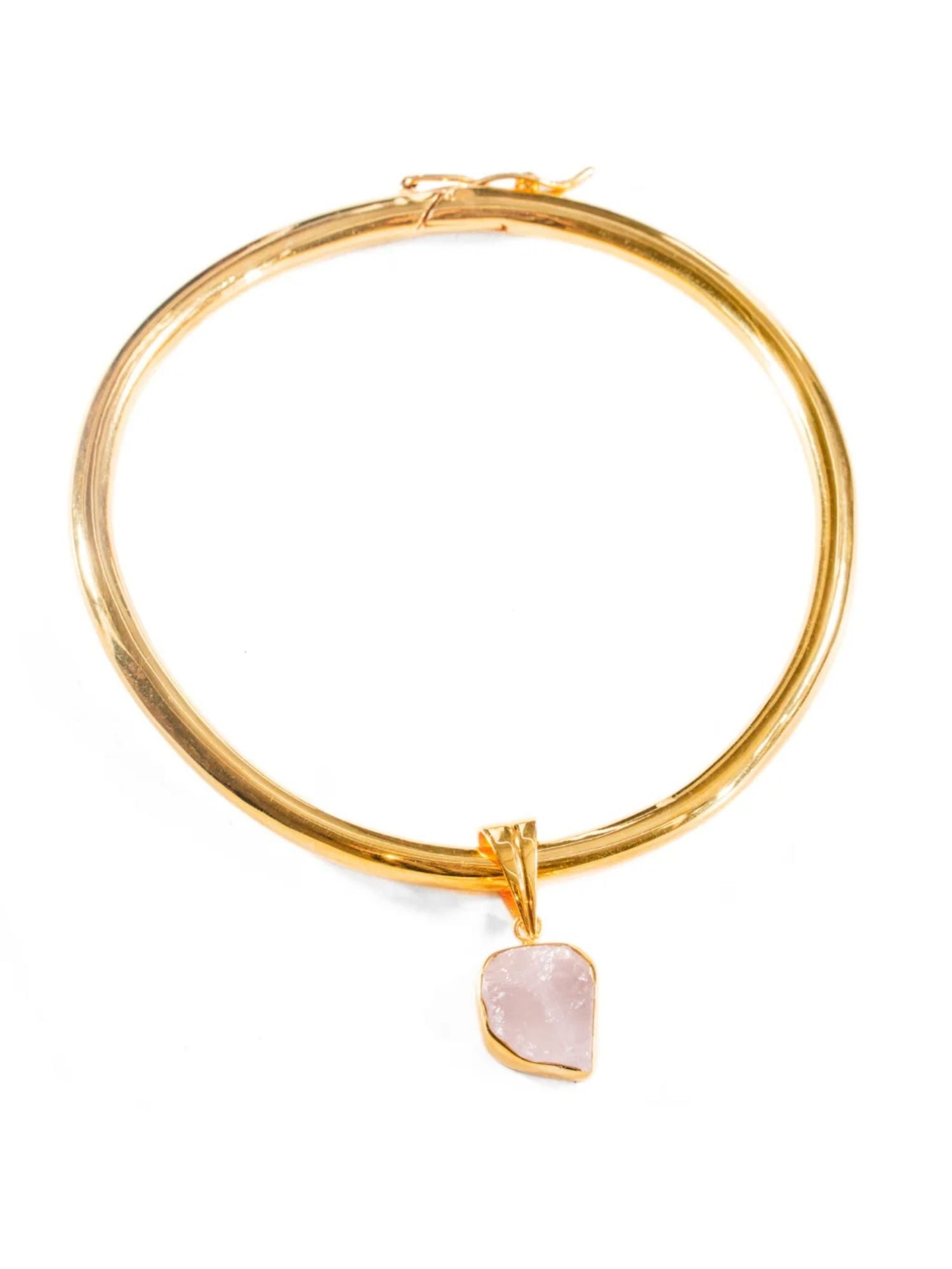 Gold bangle choker with raw rose quartz charm drop on white background