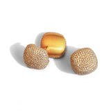 Detail shot of two gold cube earring variations showing dome and flat face