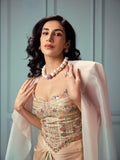 Model in ethnic dress wearing gold CZ dome ring and cube necklace