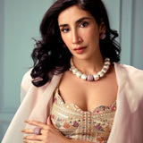 Model wearing silver Cubic Majesty set with ruby pink CZ necklace and earrings