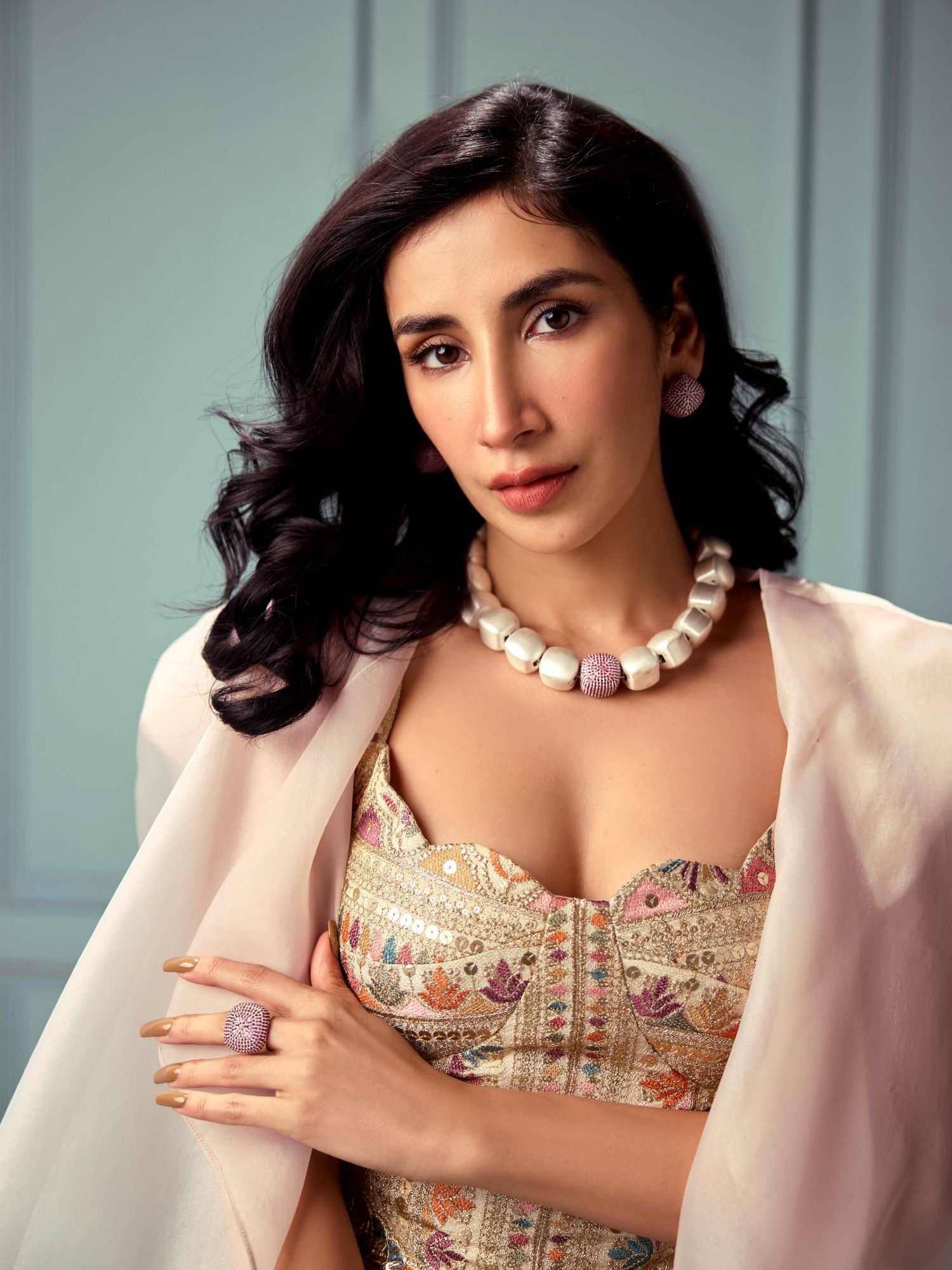 Model wearing silver Cubic Majesty set with ruby pink CZ necklace and earrings