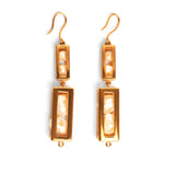 Double-drop large gold box earrings with pearl beads on white background