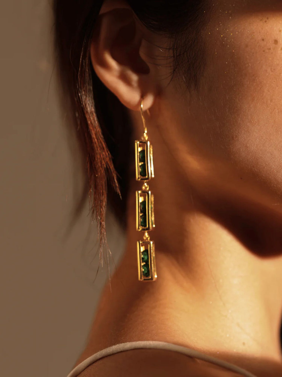 Triple-drop gold box link earrings with agate beads on white background