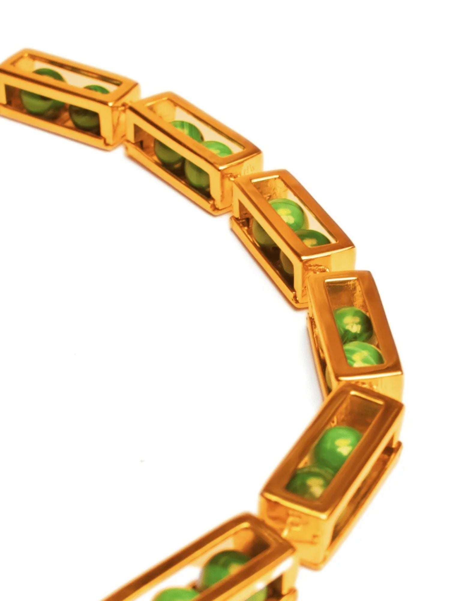 Close detail of large gold box link necklace showing open malachite bead compartments