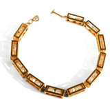 Large gold box link choker necklace with pearl beads on white background