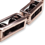 Close detail of large silver box link necklace showing open compartment mechanism