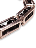 Close detail of large silver box link necklace showing open compartment mechanism