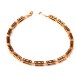 Flat lay of gold Fill Me In box link choker necklace with agate stone beads