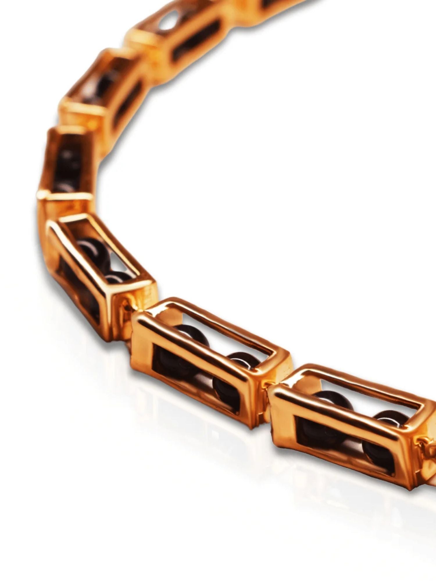 Close-up of open gold box link showing interchangeable bead mechanism