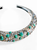 Detail shot of oxidised silver green opal hasli necklace showing stone texture