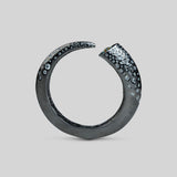 Irodori black oxidised silver bangle with zircon cluster tip detail, full form on neutral background.