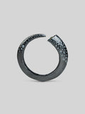 Irodori black oxidised silver bangle with zircon cluster tip detail, full form on neutral background.