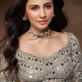 Model wearing sculptural silver Irodori flower motif choker with zircon centres at collarbone