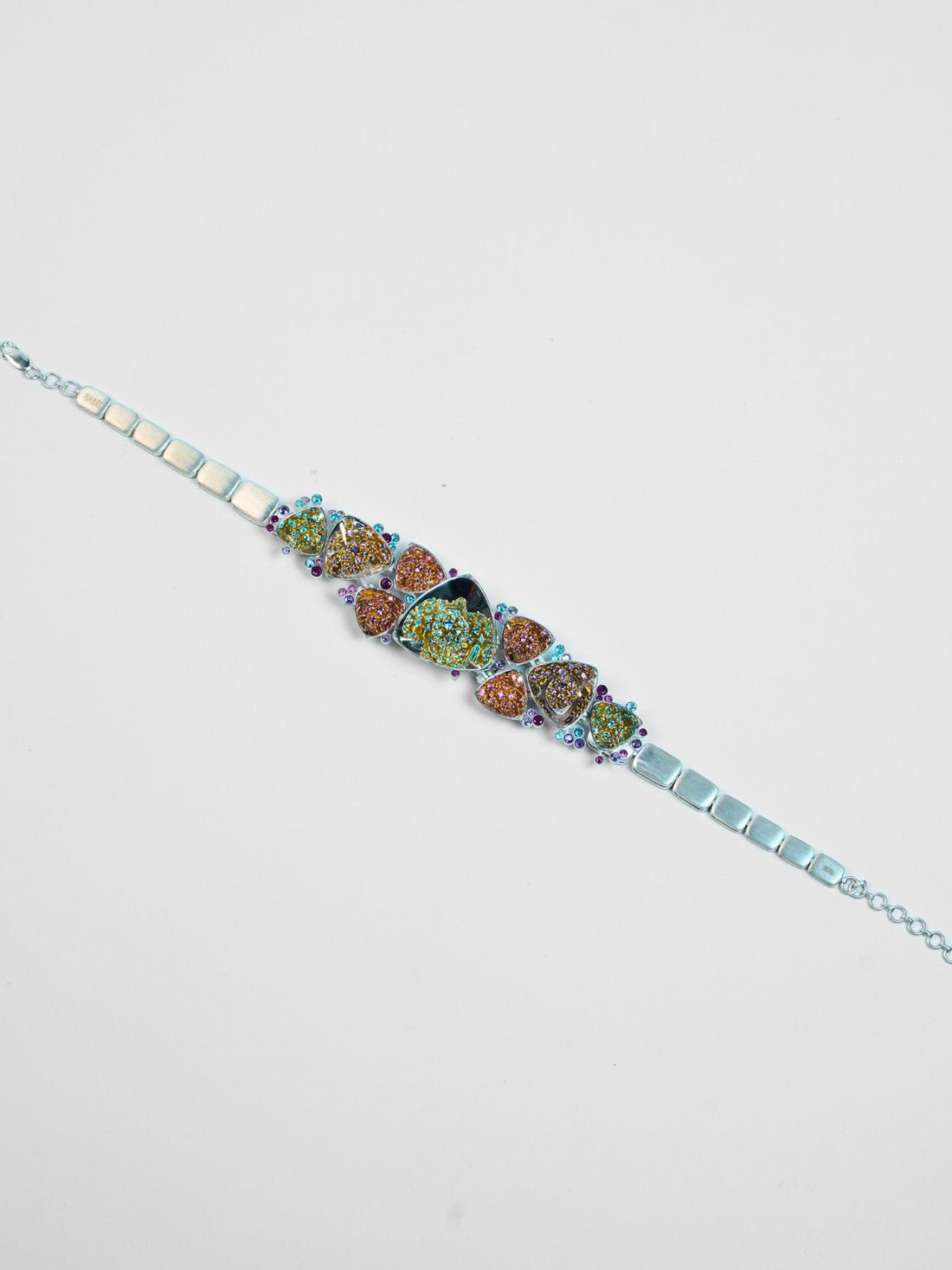 Model wearing sculptural silver Irodori flower motif choker with zircon centres at collarbone